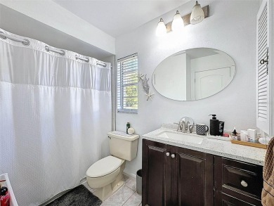 SERENITY AWAITS WITH THIS MOVE-IN READY home with private oasis on Seven Springs Golf and Country Club in Florida - for sale on GolfHomes.com, golf home, golf lot