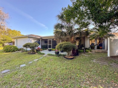 SERENITY AWAITS WITH THIS MOVE-IN READY home with private oasis on Seven Springs Golf and Country Club in Florida - for sale on GolfHomes.com, golf home, golf lot