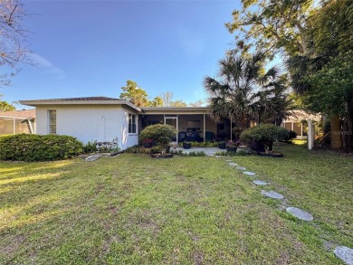 SERENITY AWAITS WITH THIS MOVE-IN READY home with private oasis on Seven Springs Golf and Country Club in Florida - for sale on GolfHomes.com, golf home, golf lot