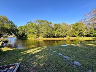 SERENITY AWAITS WITH THIS MOVE-IN READY home with private oasis on Seven Springs Golf and Country Club in Florida - for sale on GolfHomes.com, golf home, golf lot