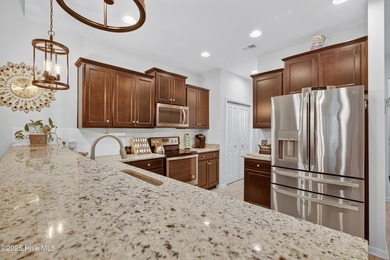 Discover low-maintenance living in the heart of Beacon Townes! on Carolina Shores Golf Course in North Carolina - for sale on GolfHomes.com, golf home, golf lot