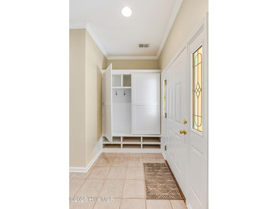 Discover relaxed coastal living in this charming 3-bedroom on Carolina National Golf Club in North Carolina - for sale on GolfHomes.com, golf home, golf lot