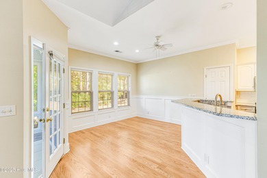 Discover relaxed coastal living in this charming 3-bedroom on Carolina National Golf Club in North Carolina - for sale on GolfHomes.com, golf home, golf lot