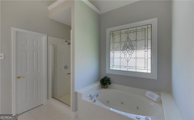 Located in the highly sought after Hamilton Mill community, this on Hamilton Mill Golf Club in Georgia - for sale on GolfHomes.com, golf home, golf lot