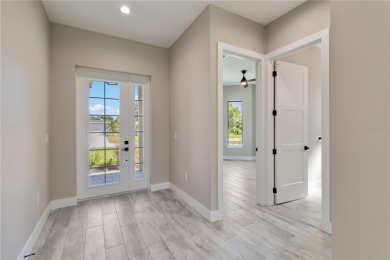 This brand-new, custom-built residence is nestled in the serene on Rotonda Golf and Country Club The Palms Course in Florida - for sale on GolfHomes.com, golf home, golf lot