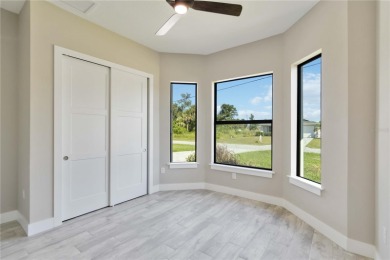This brand-new, custom-built residence is nestled in the serene on Rotonda Golf and Country Club The Palms Course in Florida - for sale on GolfHomes.com, golf home, golf lot