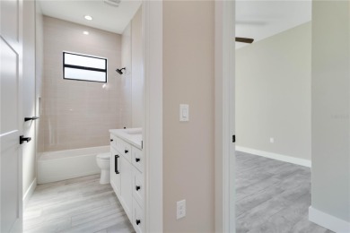 This brand-new, custom-built residence is nestled in the serene on Rotonda Golf and Country Club The Palms Course in Florida - for sale on GolfHomes.com, golf home, golf lot