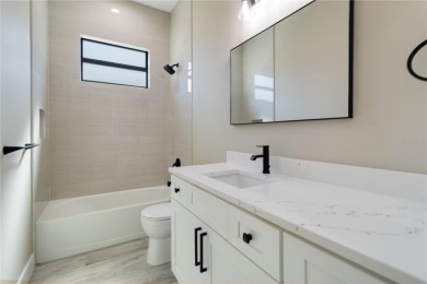 This brand-new, custom-built residence is nestled in the serene on Rotonda Golf and Country Club The Palms Course in Florida - for sale on GolfHomes.com, golf home, golf lot