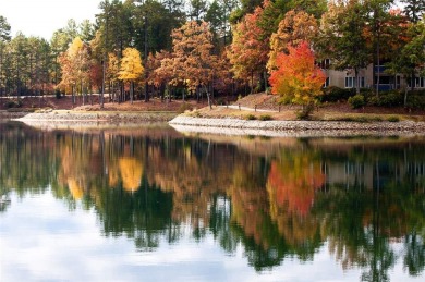 A lake house with a fabulous long range view! This custom built on Keowee Key Golf and Country Club in South Carolina - for sale on GolfHomes.com, golf home, golf lot