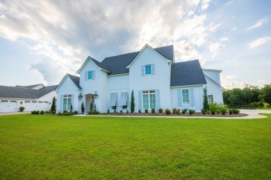 Indulge in luxury living with this magnificent 5-bedroom, 4 full on Kinderlou Forest Golf Club in Georgia - for sale on GolfHomes.com, golf home, golf lot