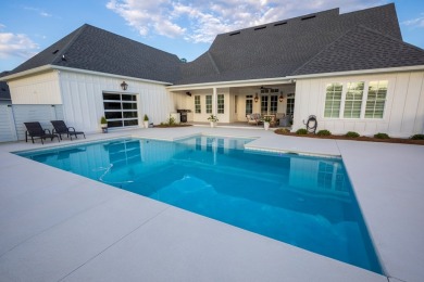 Indulge in luxury living with this magnificent 5-bedroom, 4 full on Kinderlou Forest Golf Club in Georgia - for sale on GolfHomes.com, golf home, golf lot