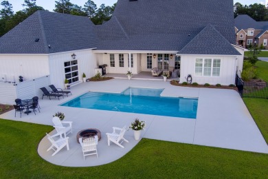 Indulge in luxury living with this magnificent 5-bedroom, 4 full on Kinderlou Forest Golf Club in Georgia - for sale on GolfHomes.com, golf home, golf lot