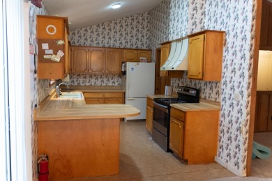 This lovely home on the 13th hole of the Indian Hills golf on Indian Hills Country Club in Arkansas - for sale on GolfHomes.com, golf home, golf lot