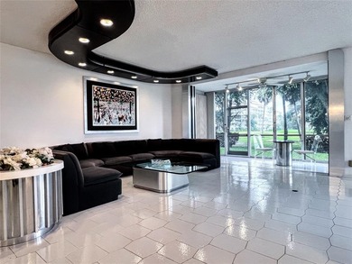 Welcome to this spacious and well-maintained 3-bedroom, 2.5-bath on Palm-Aire Country Club and Resort - The Oaks in Florida - for sale on GolfHomes.com, golf home, golf lot