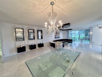 Welcome to this spacious and well-maintained 3-bedroom, 2.5-bath on Palm-Aire Country Club and Resort - The Oaks in Florida - for sale on GolfHomes.com, golf home, golf lot