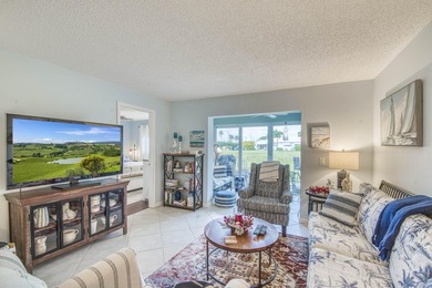 Enjoy the best of South Florida living in this beautifully on  in Florida - for sale on GolfHomes.com, golf home, golf lot