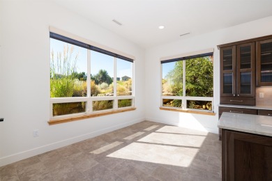 Introducing this beautifully updated ranch style home adjacent on The Golf Club At Redlands Mesa in Colorado - for sale on GolfHomes.com, golf home, golf lot