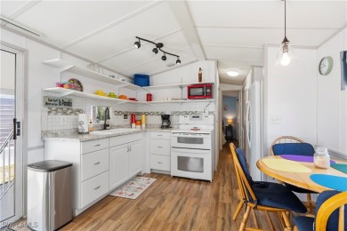 Welcome to this cozy and efficient 1-bedroom manufactured home on Del Tura Golf and Country Club in Florida - for sale on GolfHomes.com, golf home, golf lot
