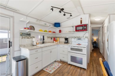 Welcome to this cozy and efficient 1-bedroom manufactured home on Del Tura Golf and Country Club in Florida - for sale on GolfHomes.com, golf home, golf lot