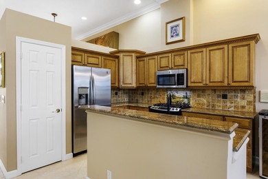 ENJOY THE FLORIDA LIFESTYLE AND LOVELY GOLF VIEWS OF THE on PGA National Estates Golf Course in Florida - for sale on GolfHomes.com, golf home, golf lot