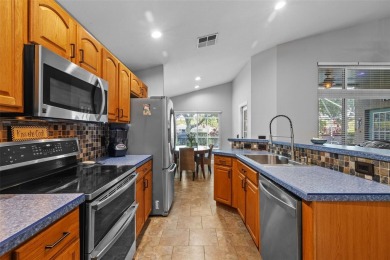 Golf course views, a private pool, and a prime location inside on TPC of Tampa Bay in Florida - for sale on GolfHomes.com, golf home, golf lot