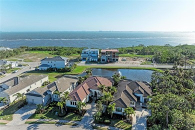 Come see this beautiful custom home in the cherished Legends Bay on IMG Academies Golf and Country Club in Florida - for sale on GolfHomes.com, golf home, golf lot