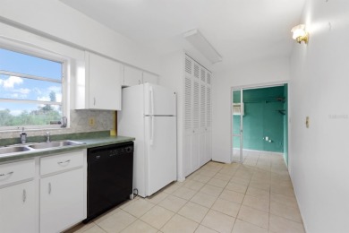 Welcome to this inviting 1963 two-bedroom, two-bathroom home on Port Charlotte Golf Club in Florida - for sale on GolfHomes.com, golf home, golf lot