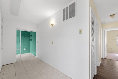 Welcome to this inviting 1963 two-bedroom, two-bathroom home on Port Charlotte Golf Club in Florida - for sale on GolfHomes.com, golf home, golf lot