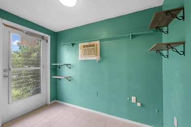 Welcome to this inviting 1963 two-bedroom, two-bathroom home on Port Charlotte Golf Club in Florida - for sale on GolfHomes.com, golf home, golf lot