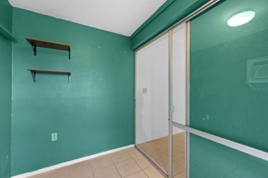 Welcome to this inviting 1963 two-bedroom, two-bathroom home on Port Charlotte Golf Club in Florida - for sale on GolfHomes.com, golf home, golf lot