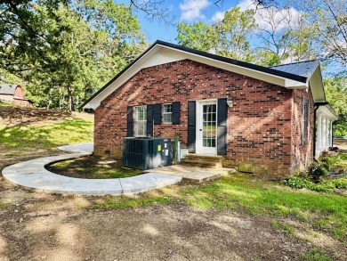 Experience luxury living in this completely remodeled 4-bedroom on Selmer Golf and Country Club in Tennessee - for sale on GolfHomes.com, golf home, golf lot