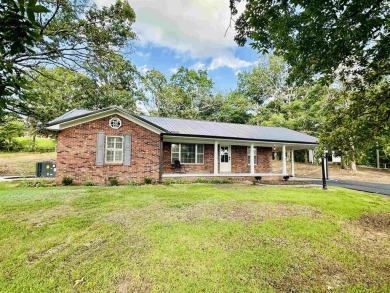 Experience luxury living in this completely remodeled 4-bedroom on Selmer Golf and Country Club in Tennessee - for sale on GolfHomes.com, golf home, golf lot