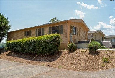 Enjoy Lake Keowee living at an affordable price! This furnished on Blue Ridge Golf Center, Inc. in South Carolina - for sale on GolfHomes.com, golf home, golf lot