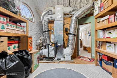 Nestled on over 1 1/2 acres in a beautiful maritime forest on Lockwood Folly Country Club in North Carolina - for sale on GolfHomes.com, golf home, golf lot