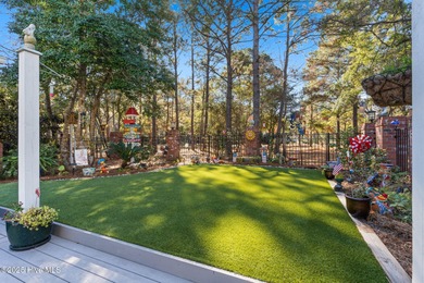 Nestled on over 1 1/2 acres in a beautiful maritime forest on Lockwood Folly Country Club in North Carolina - for sale on GolfHomes.com, golf home, golf lot