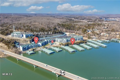 Experience lake living in this 4-bedroom, 2-bath penthouse on The Club At Old Kinderhook in Missouri - for sale on GolfHomes.com, golf home, golf lot
