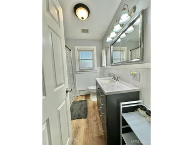 Welcome to this charming ranch home, beautifully updated and on Pine Grove Country Club in Michigan - for sale on GolfHomes.com, golf home, golf lot