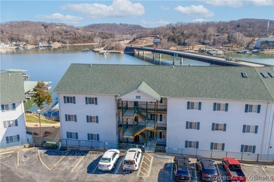 Experience lake living in this 4-bedroom, 2-bath penthouse on The Club At Old Kinderhook in Missouri - for sale on GolfHomes.com, golf home, golf lot