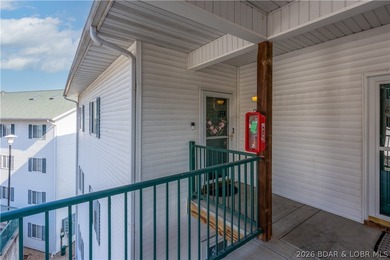 Experience lake living in this 4-bedroom, 2-bath penthouse on The Club At Old Kinderhook in Missouri - for sale on GolfHomes.com, golf home, golf lot