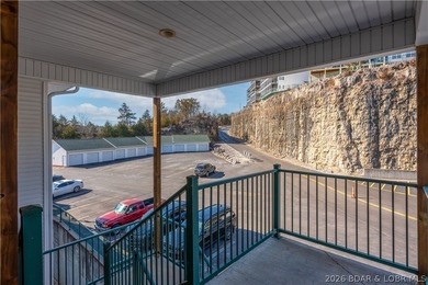 Experience lake living in this 4-bedroom, 2-bath penthouse on The Club At Old Kinderhook in Missouri - for sale on GolfHomes.com, golf home, golf lot