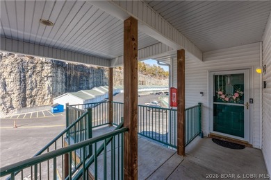 Experience lake living in this 4-bedroom, 2-bath penthouse on The Club At Old Kinderhook in Missouri - for sale on GolfHomes.com, golf home, golf lot