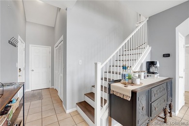 Experience lake living in this 4-bedroom, 2-bath penthouse on The Club At Old Kinderhook in Missouri - for sale on GolfHomes.com, golf home, golf lot