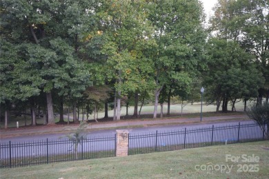 This lot is located in an artfully designed full service on Rock Barn Golf and Spa in North Carolina - for sale on GolfHomes.com, golf home, golf lot