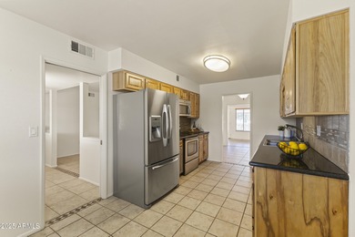 Welcome to this SPACIOUS 3-bedroom, 2-bath, 2-car garage home in on Sun City Lakes West and East in Arizona - for sale on GolfHomes.com, golf home, golf lot