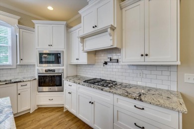 Step into luxury with this stunning custom-built home in the on Bartram Trail Golf Club in Georgia - for sale on GolfHomes.com, golf home, golf lot