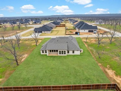 Welcome to this exceptional new build in the coveted, guarded on Pecan Plantation Country Club in Texas - for sale on GolfHomes.com, golf home, golf lot