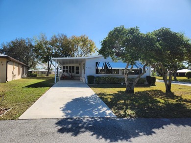 This spacious 2-bed/2-bath home with a den/family room situated on Spanish Lakes Fairways in Florida - for sale on GolfHomes.com, golf home, golf lot