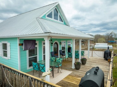 A river house with a view! This home offers 4 beds, 3 full baths on Tennessee River Golf Club in Tennessee - for sale on GolfHomes.com, golf home, golf lot