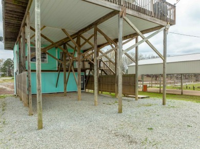 A river house with a view! This home offers 4 beds, 3 full baths on Tennessee River Golf Club in Tennessee - for sale on GolfHomes.com, golf home, golf lot