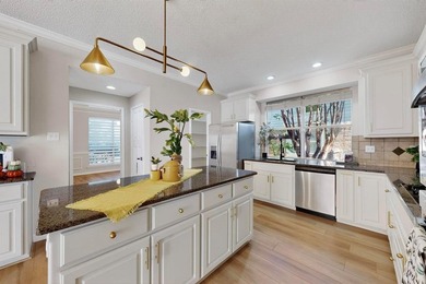 Stunning Traditional-style home featuring a symmetrical brick on The Courses at Watters Creek in Texas - for sale on GolfHomes.com, golf home, golf lot